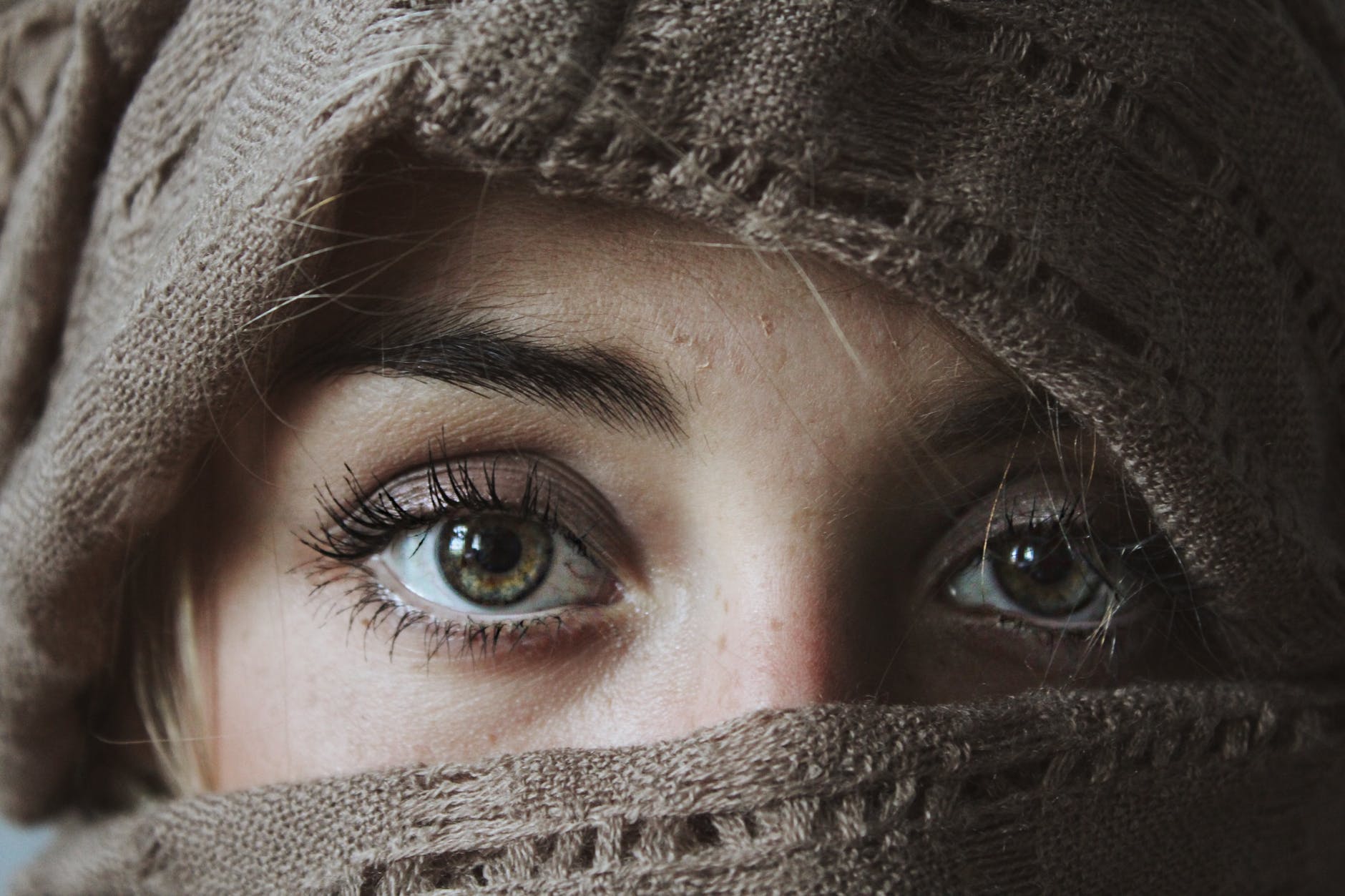 A women covering everything but her eyes 